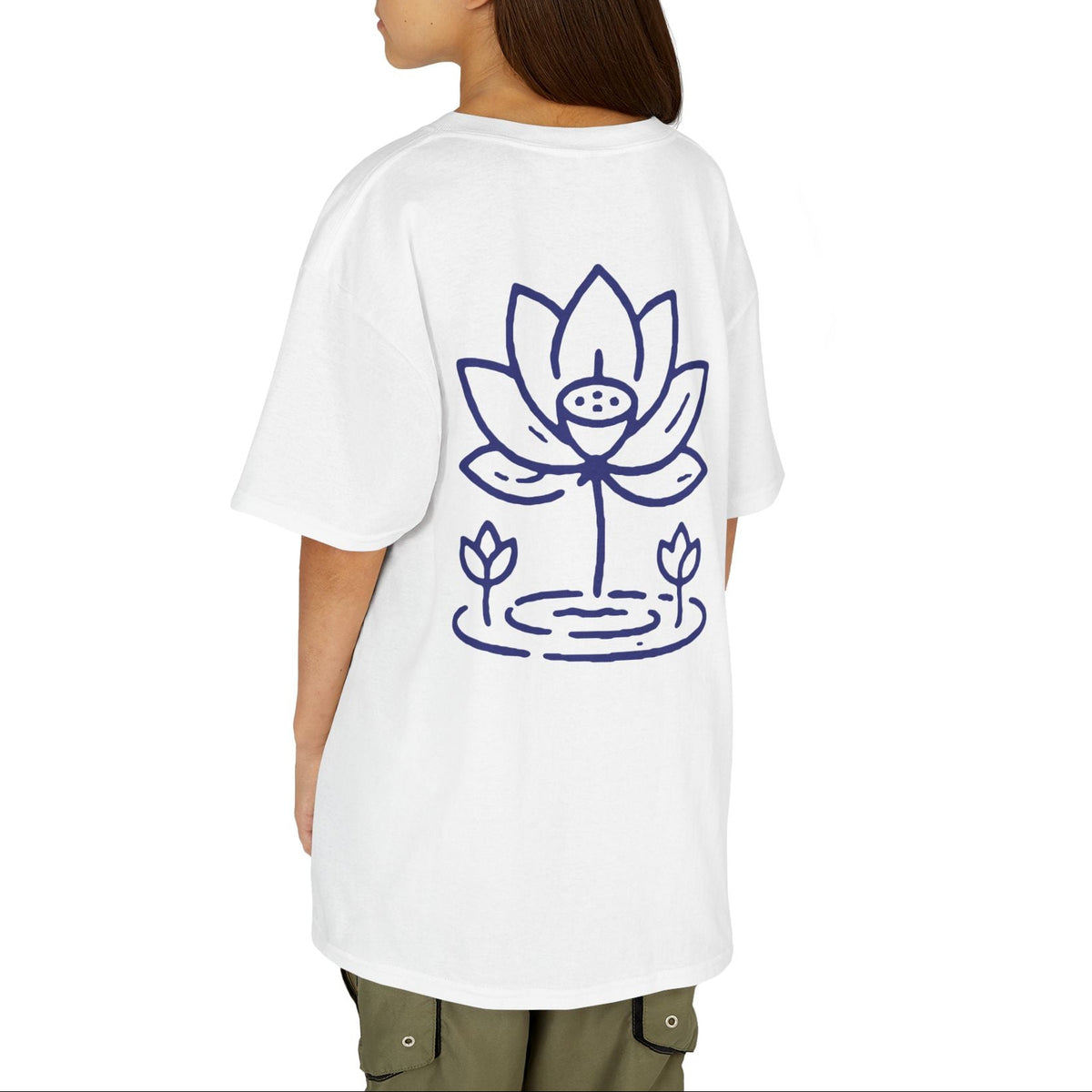 A model shown from the back wearing an oversized white t-shirt with a blue line art graphic of a lotus flower on the back, paired with olive green cargo pants against a solid white background.